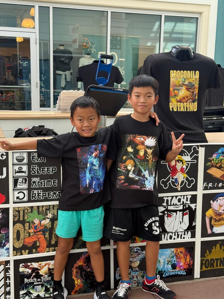 Happy young customers with custom tees